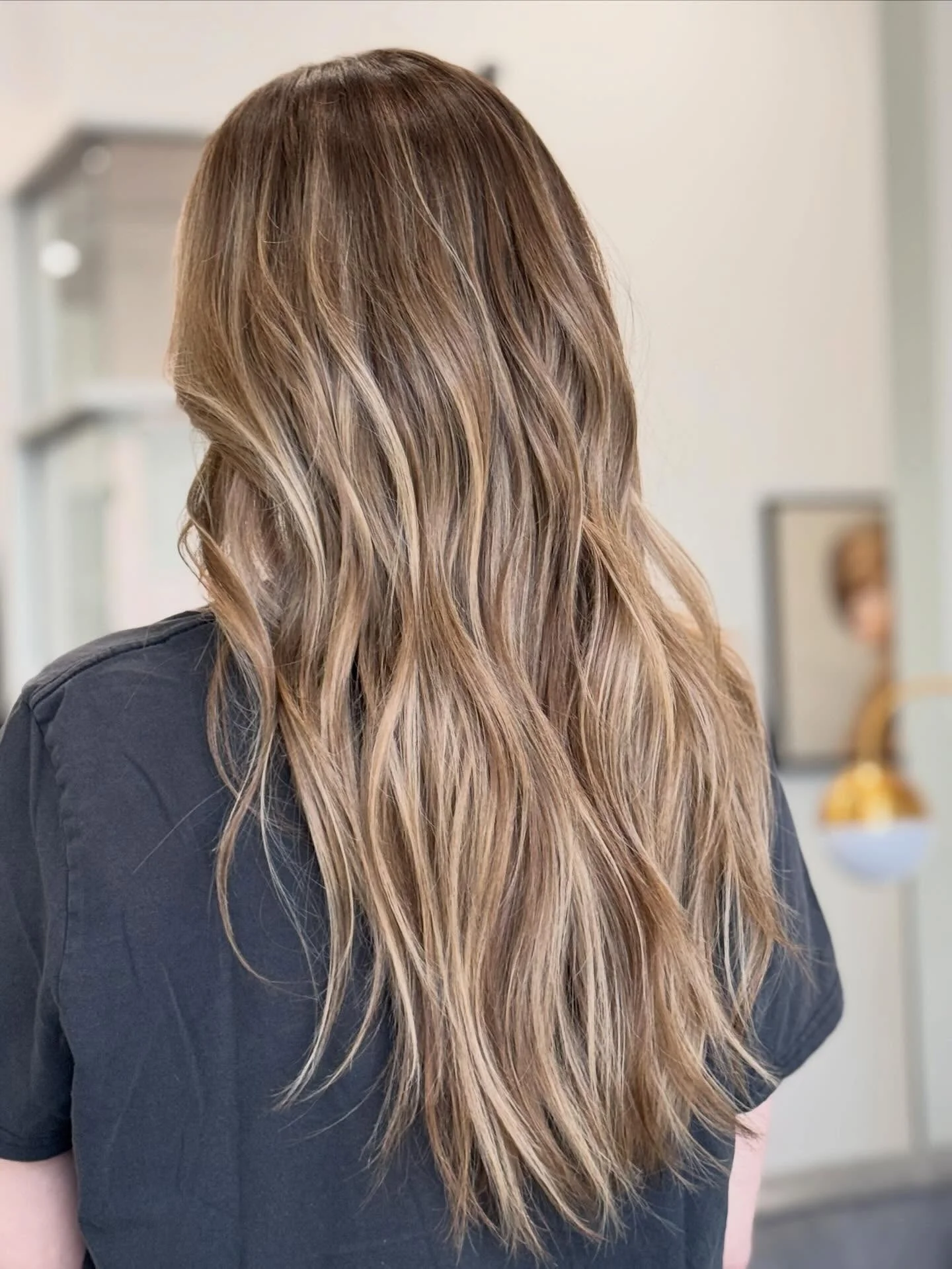 fall blonde hair color 2026 Toasted Beige Balayage With Lived In Waves