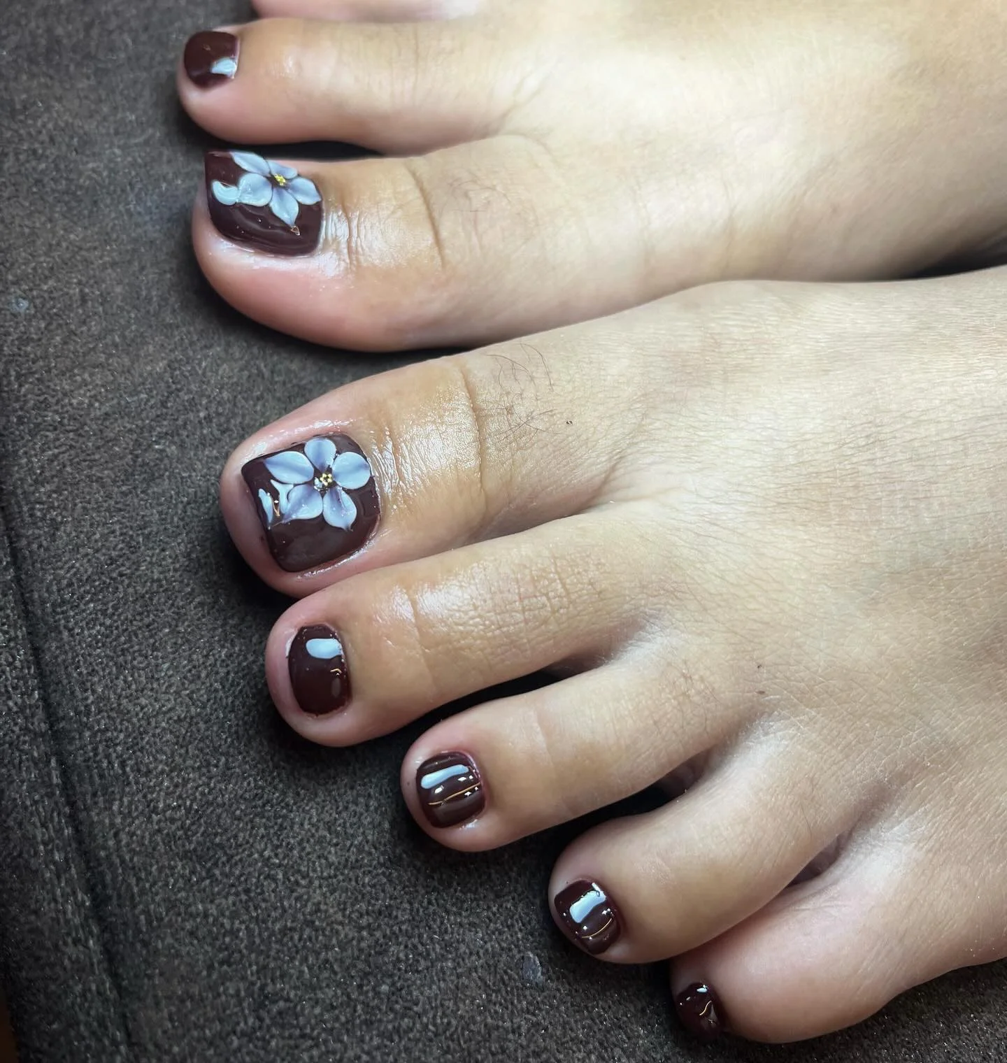 fall pedicure ideas 2026 Chocolate Floral Pedicure With Soft Blue Blossoms