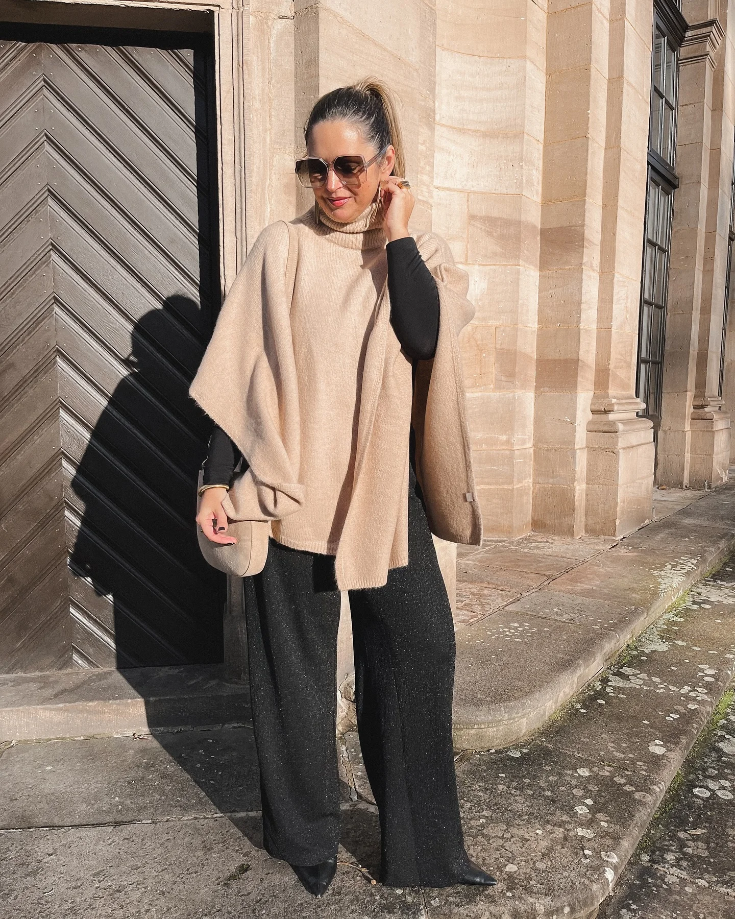 fall poncho outfits 2026 Minimalist Beige Knit Poncho With Wide-Leg Trousers