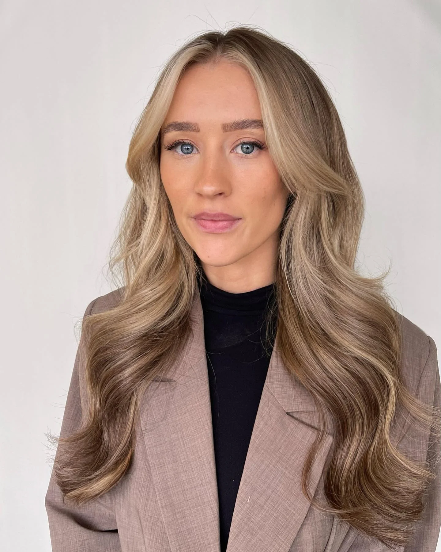 dirty blonde hair color Voluminous Dirty Blonde Waves With Bright Money Piece