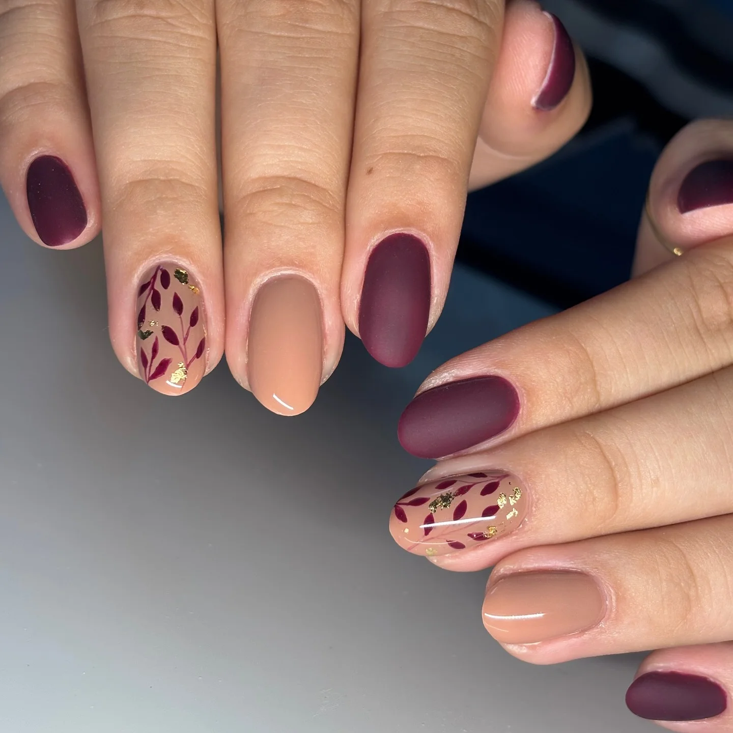 fall manicure 2026 Matte Plum Elegance With Botanical Leaf Details