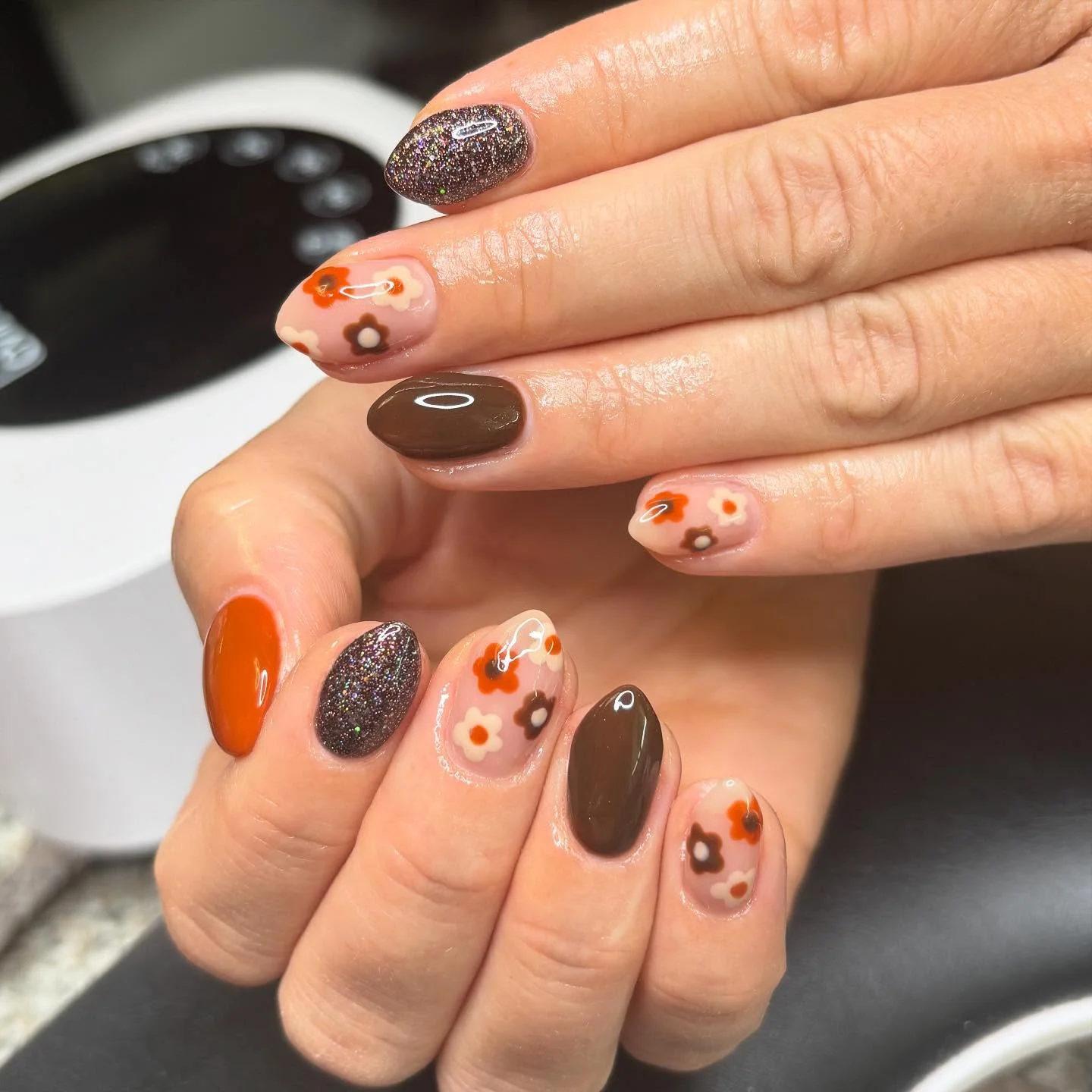 fall manicure 2026 Retro Floral Mix With Glittery Espresso Accents