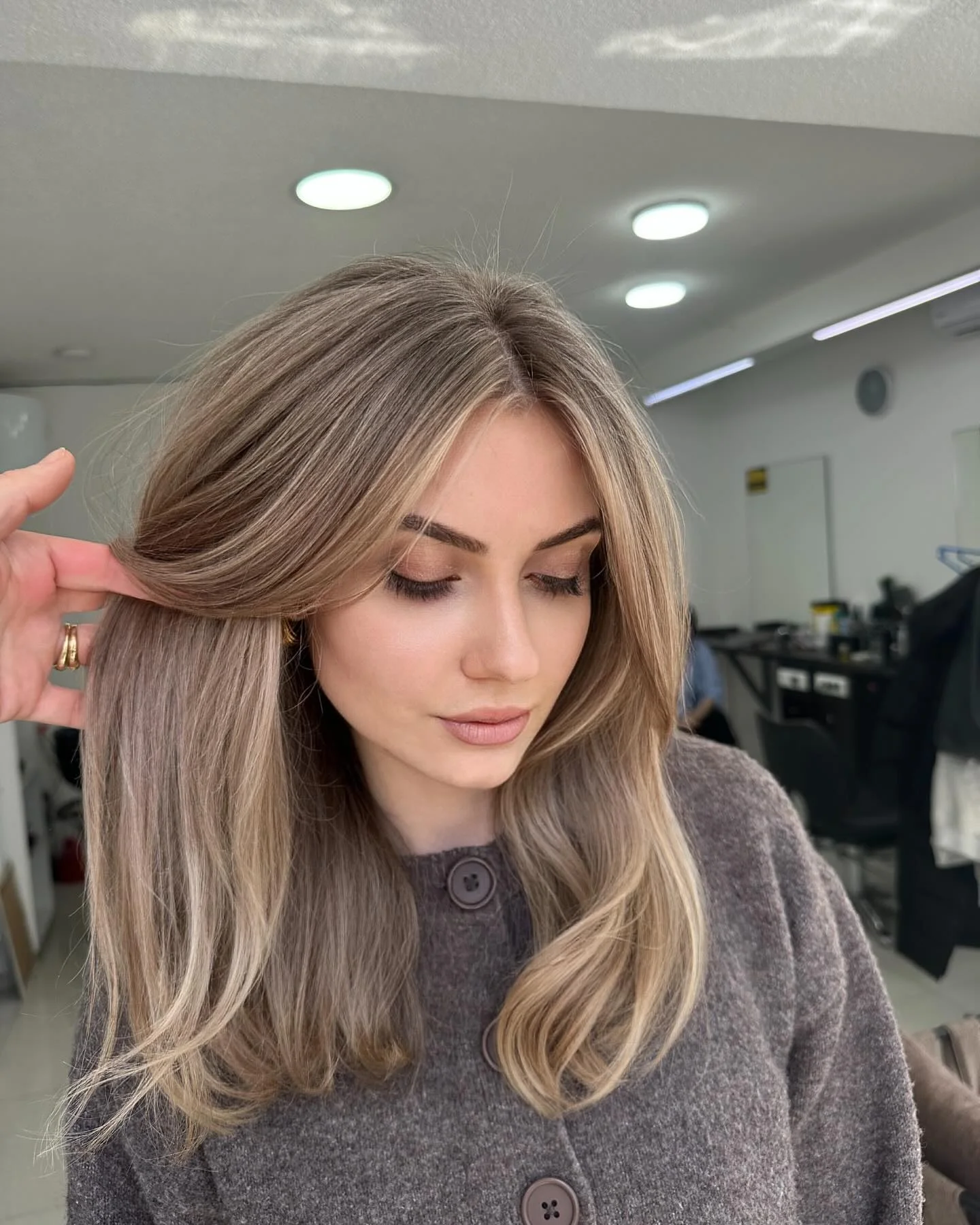 dirty blonde hair color Soft Mushroom Dirty Blonde With Curtain Layers