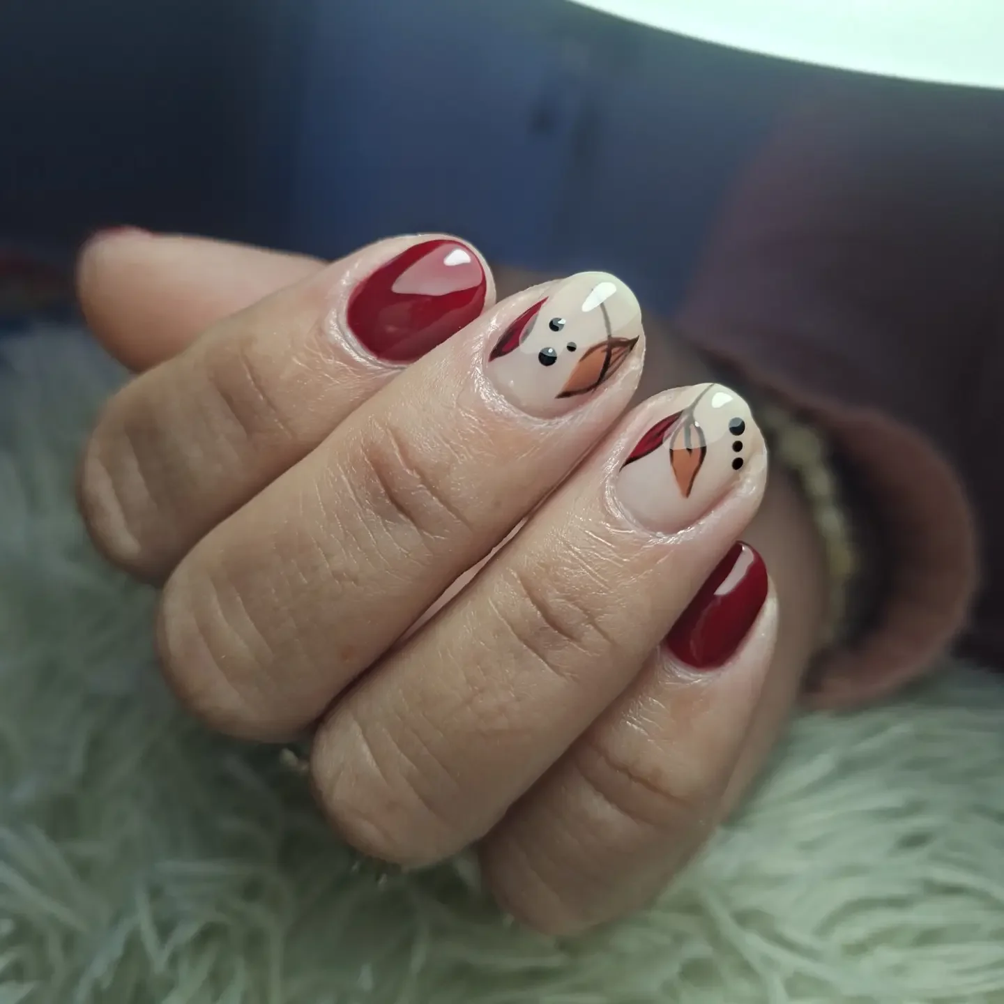fall red nails 2026 Minimal Autumn Leaf Accent On Deep Red Nails