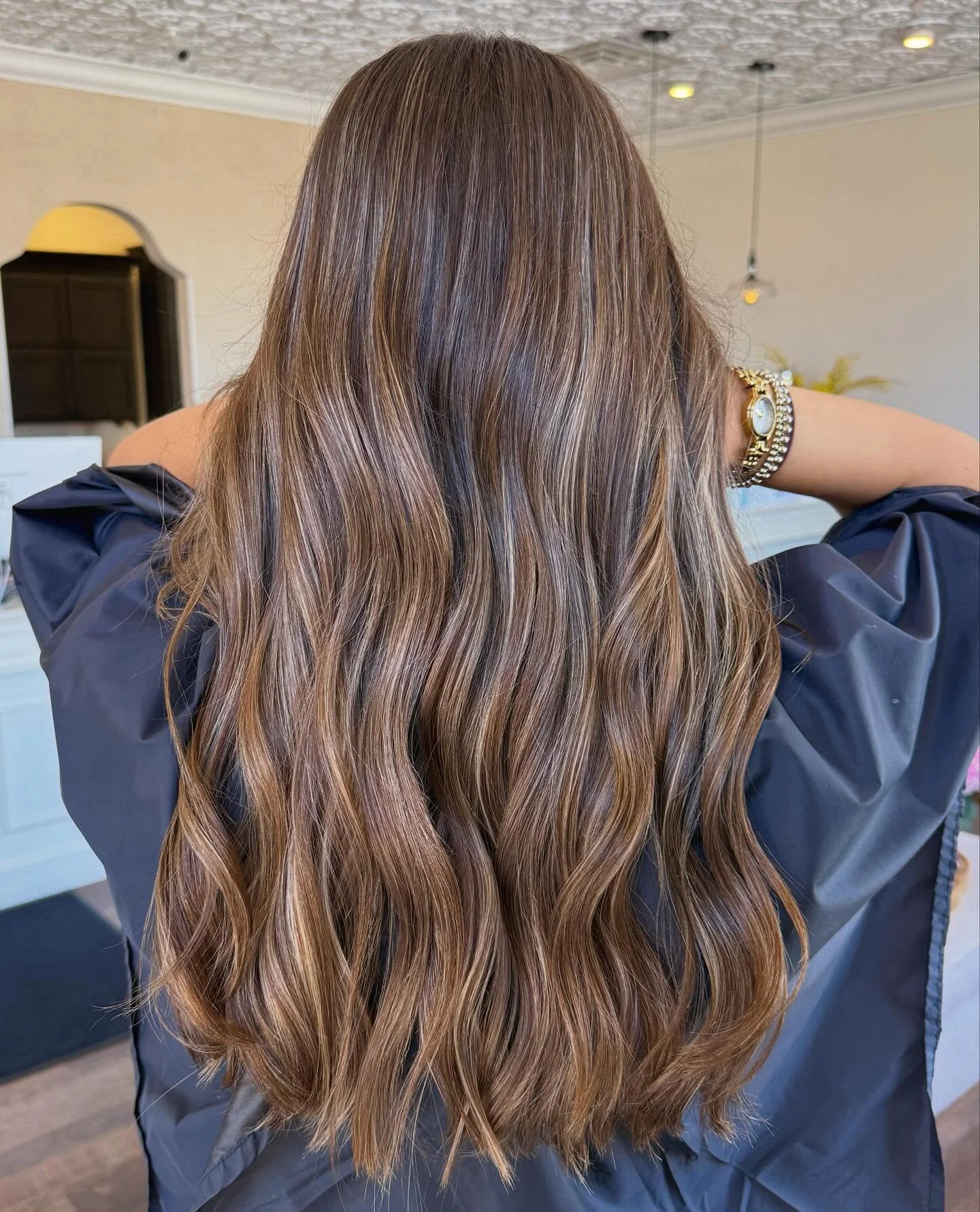 fall hair color ideas 2026 Soft Mocha Waves With Caramel Dimension