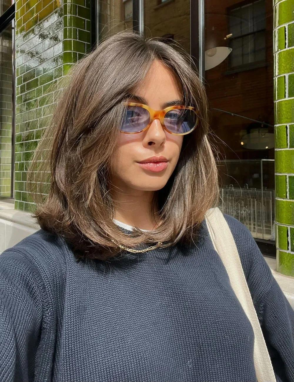 choppy medium layered hair Modern Feathered Bob With Effortless Volume