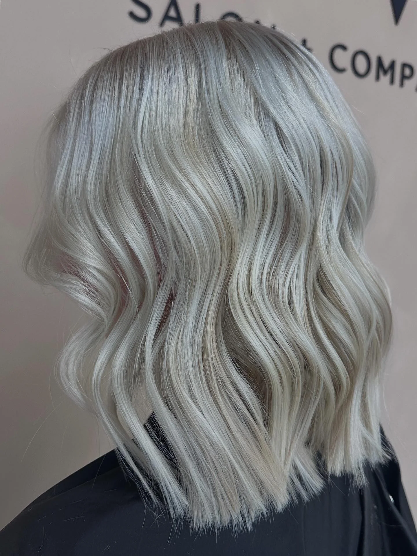 fall blonde hair color 2026 Cool Pearl Blonde Wavy Short Bob