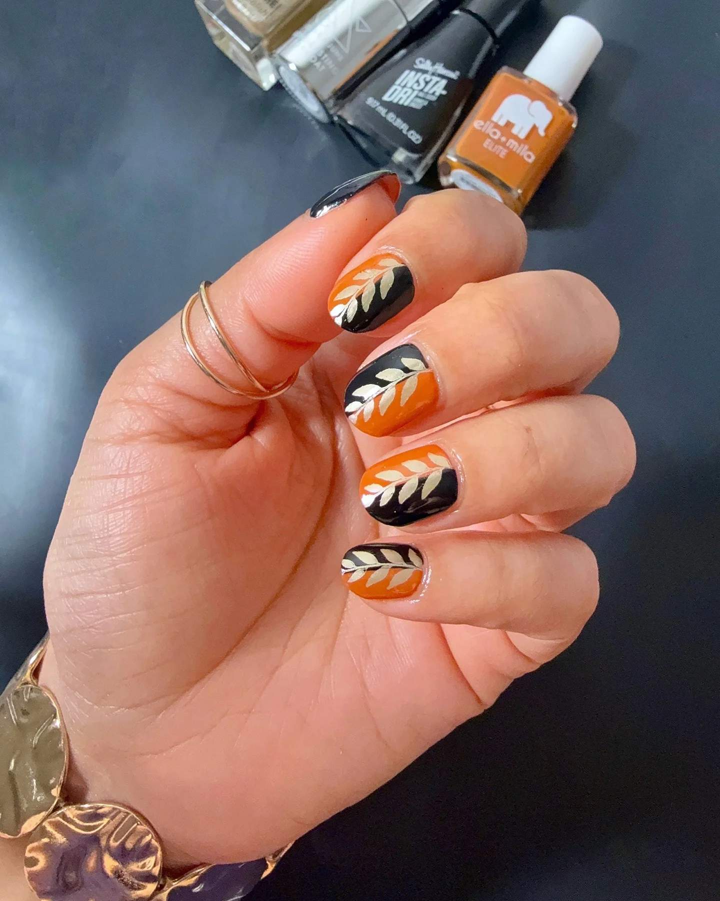 fall short nails 2026 Bold Orange And Black Botanical Autumn Nails