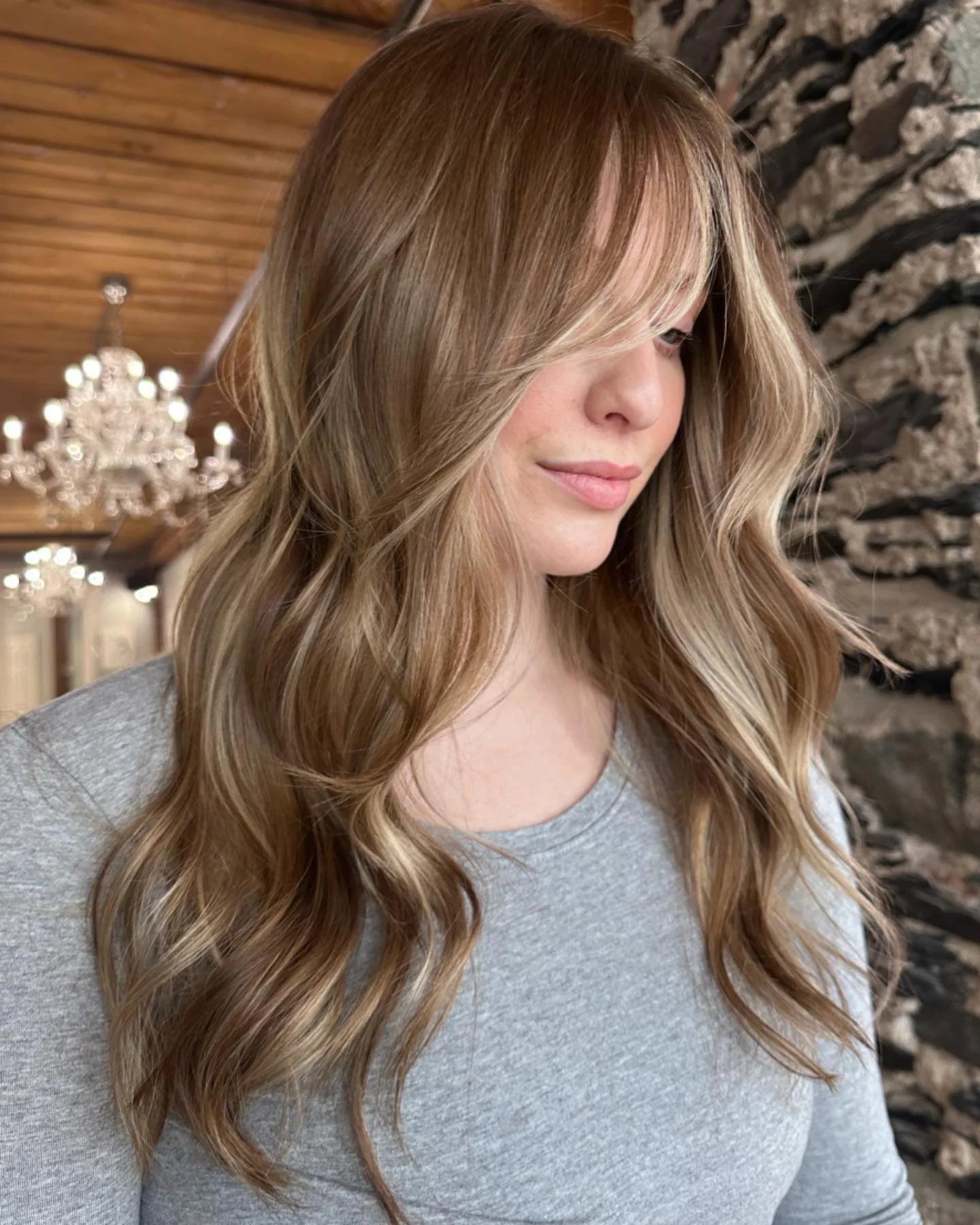 dirty blonde hair color Long Curtain Bangs With Lived-In Blonde Balayage