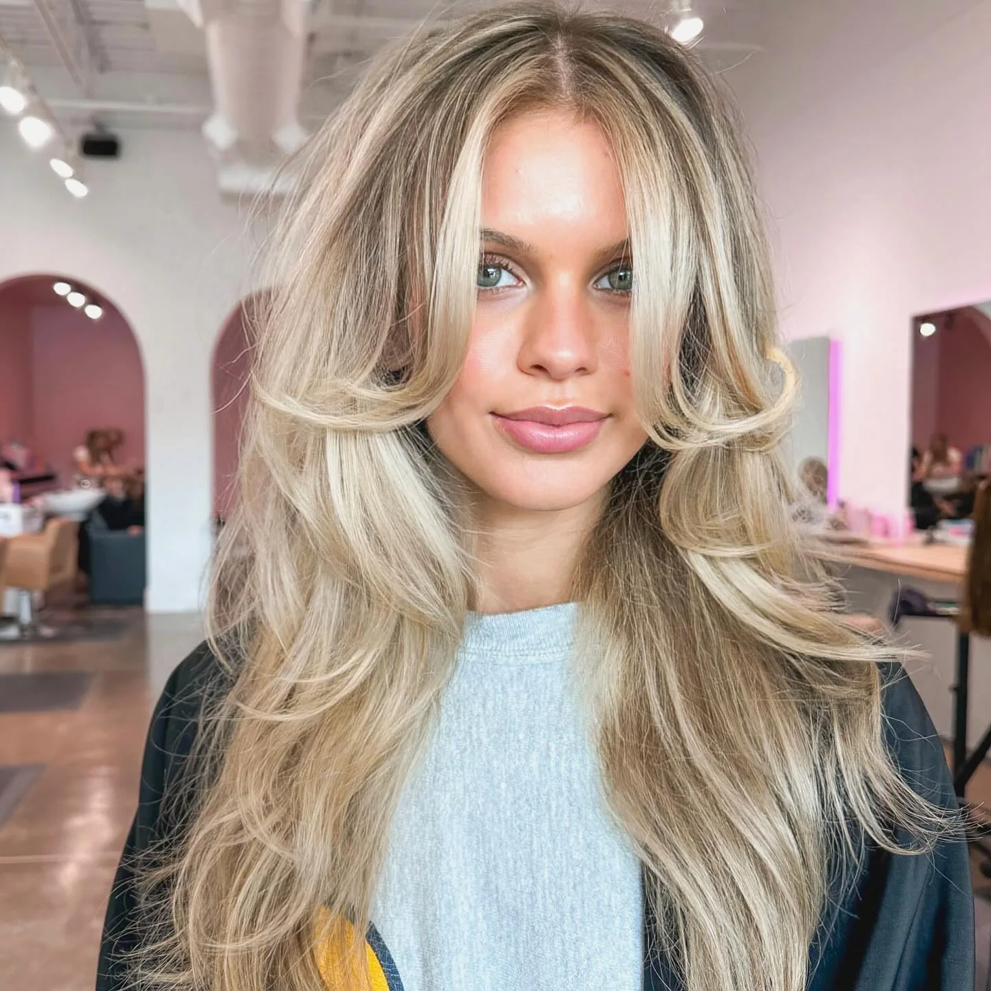 fall blonde hair color 2026 Bright Butterfly Layers With Cool Blonde Ribbons