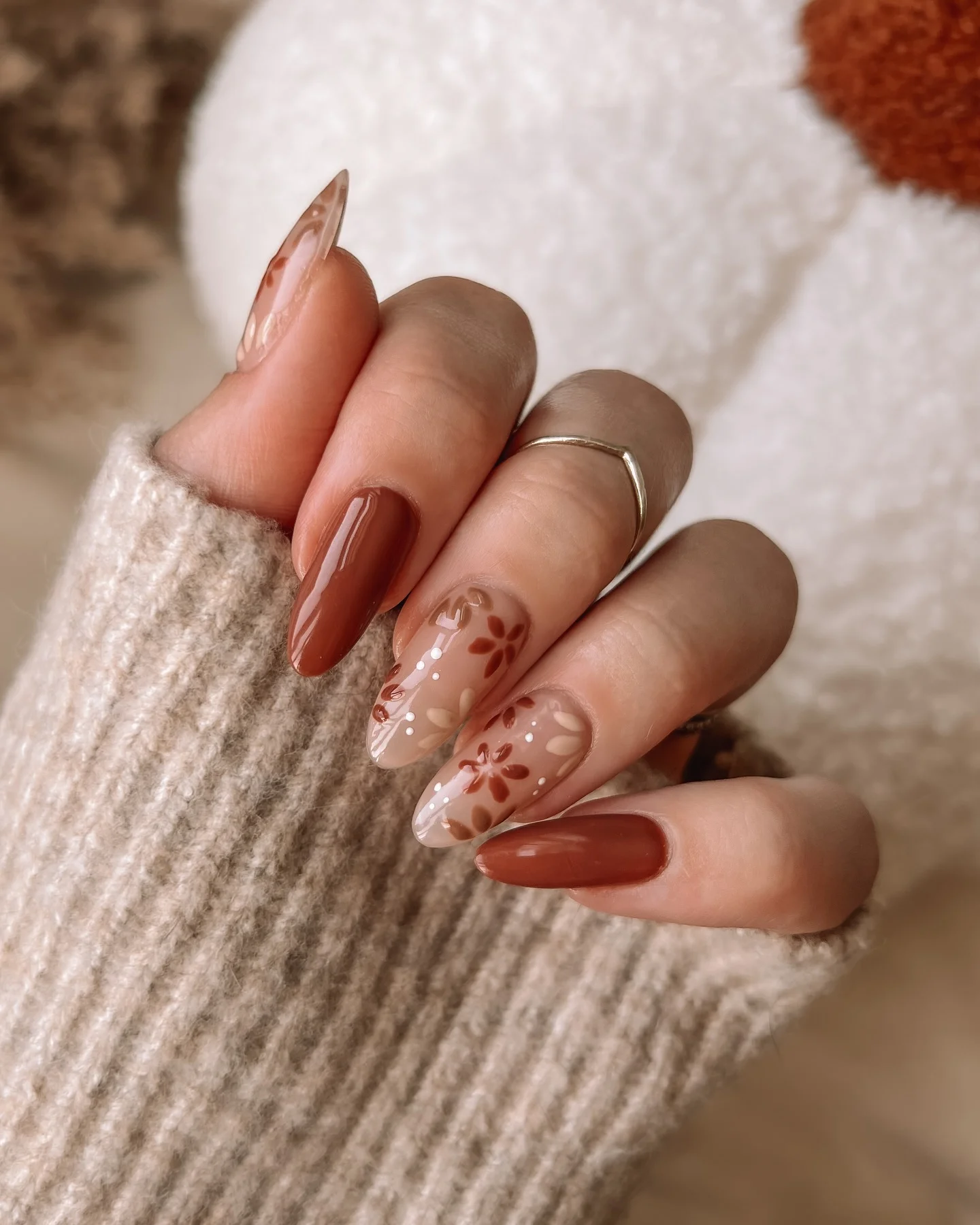 fall manicure 2026 Glossy Cinnamon Nails With Soft Botanical Art