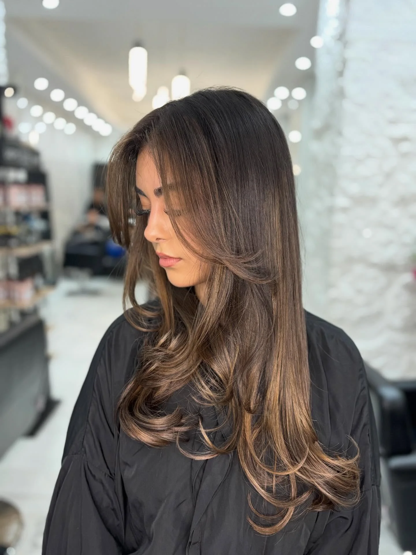 hair lowlights: color ideas and inspiration Long Layered Brunette With Soft Caramel Dimension