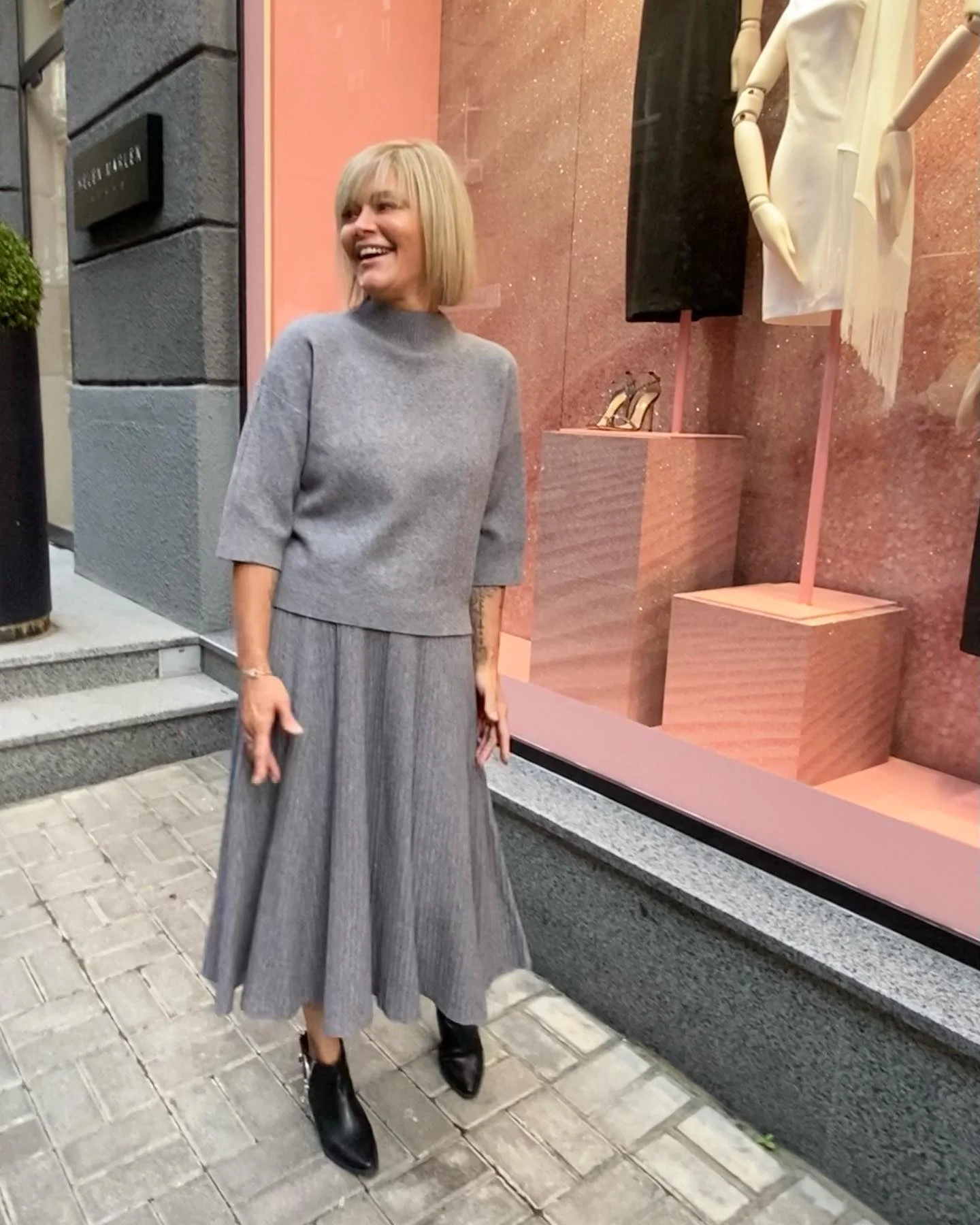 knit skirt outfits fall 2026 Soft Grey Knit Set With A Flowing Midi Skirt