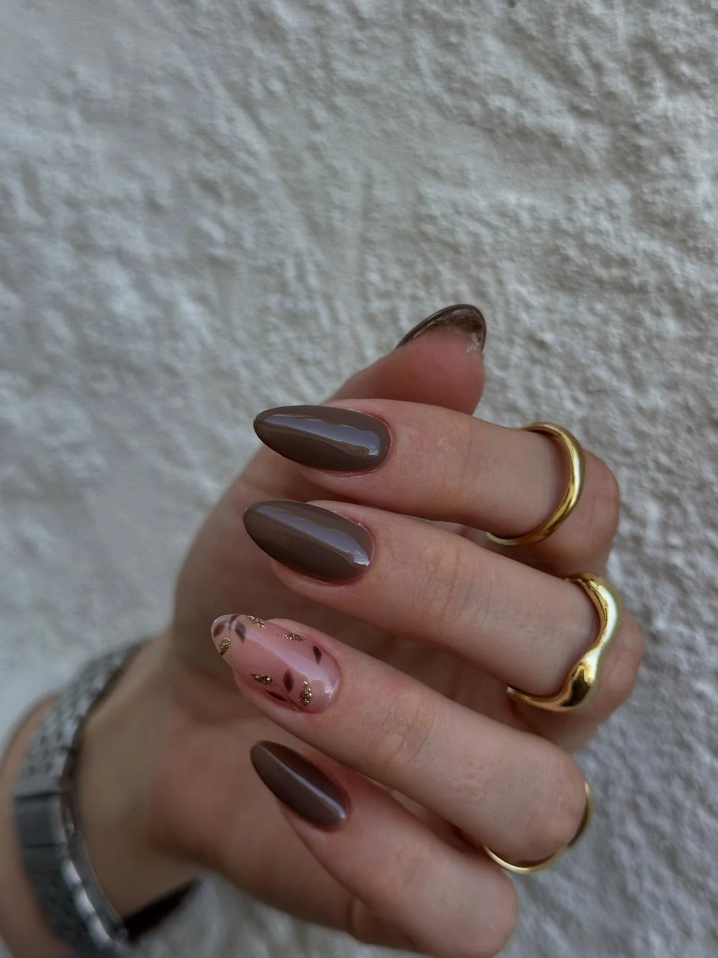 fall almond nails 2026 Glossy Cocoa Minimalism With Golden Leaf Accents