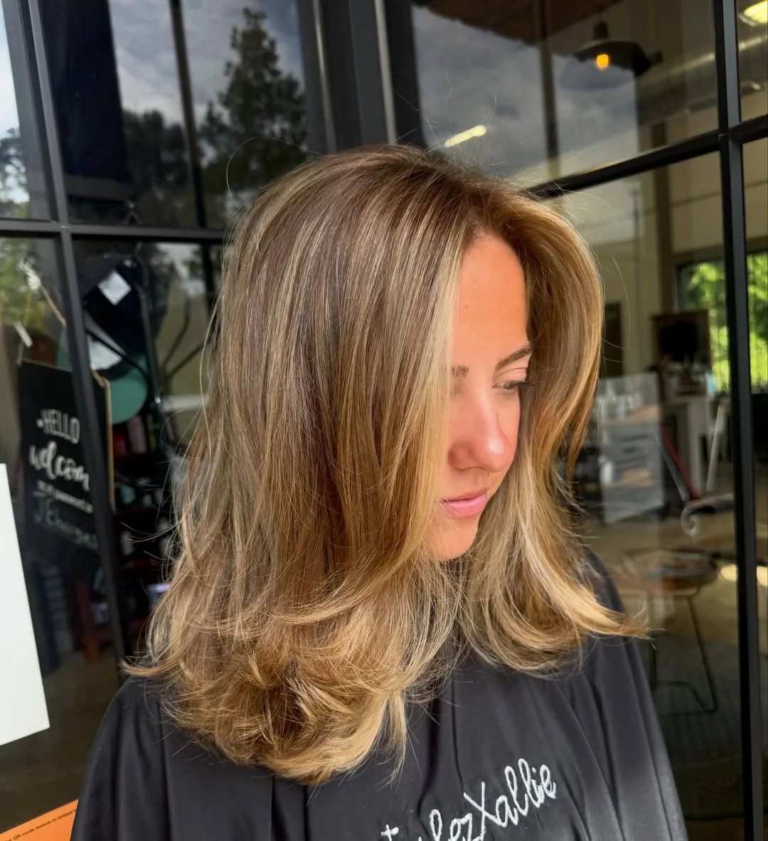 dirty blonde hair color Feathered Blowout With Golden Dirty Blonde Layers