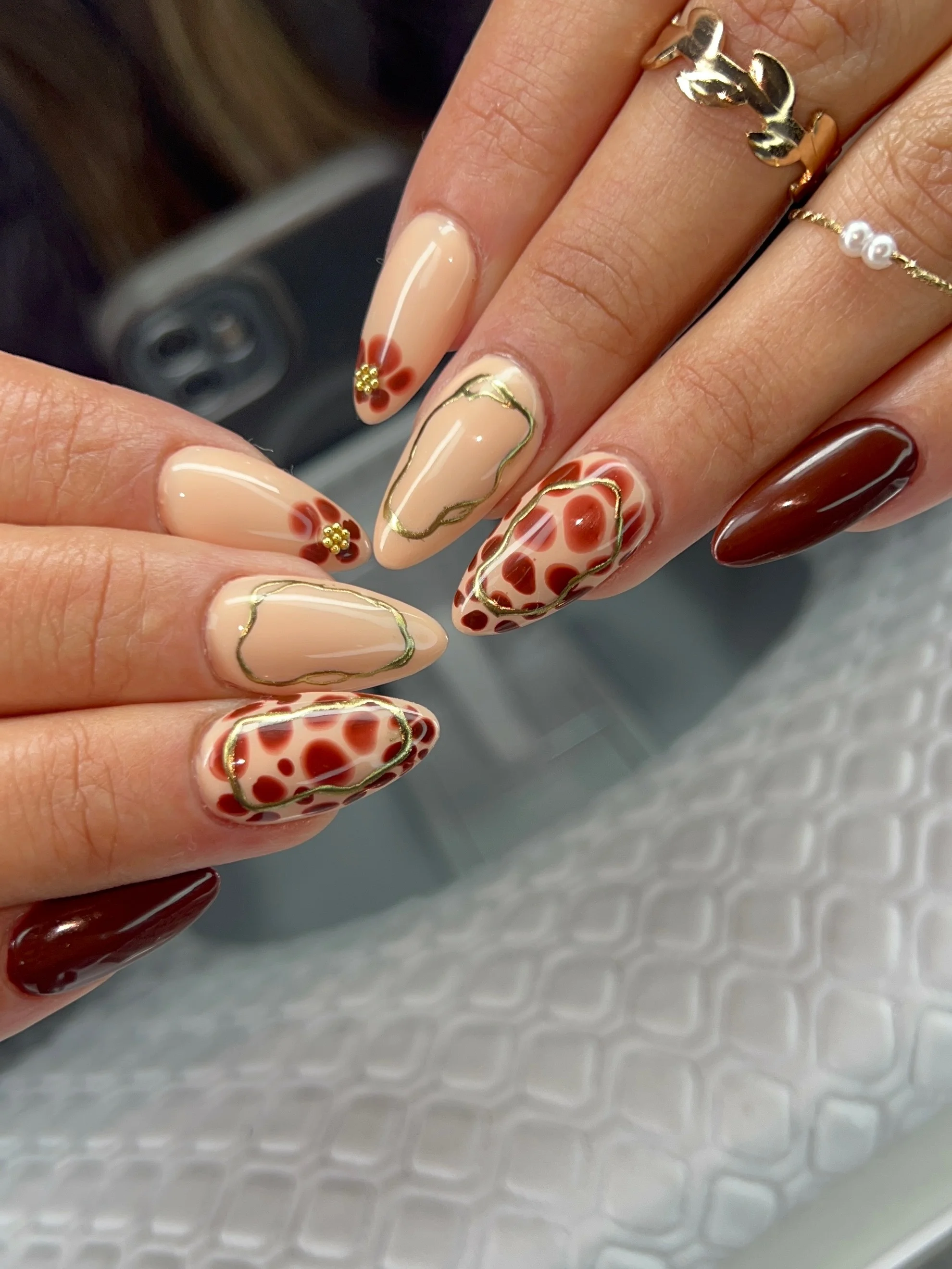 september nail art ideas 2026 Elegant Mocha Swirls With Modern Floral Accents