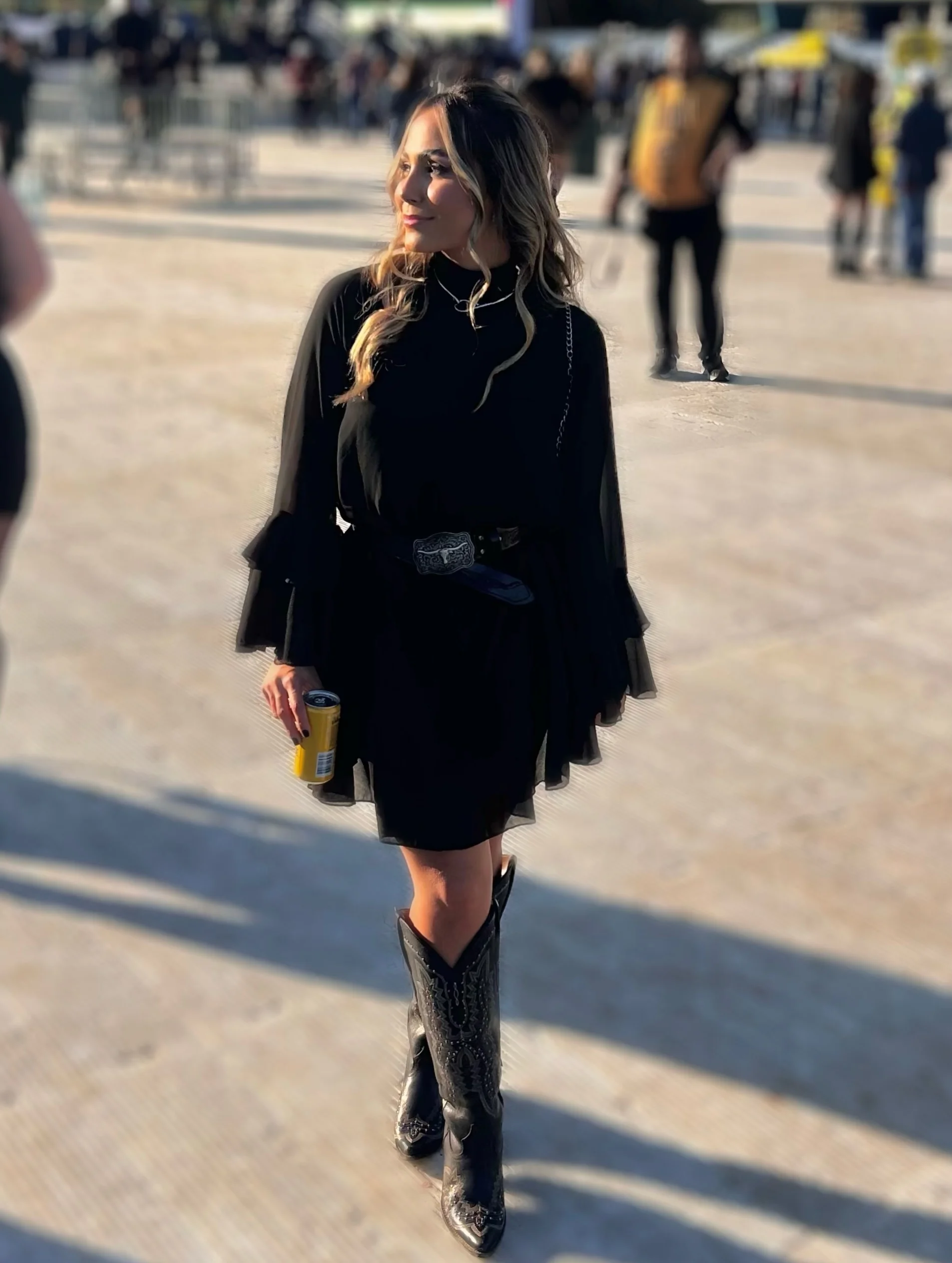 fall concert outfits 2026 Classic Black Mini Dress Styled With Cowboy Boots