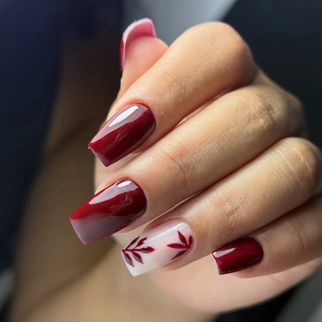 fall red nails 2026 Glossy Burgundy Ombre With Botanical Accent Nails