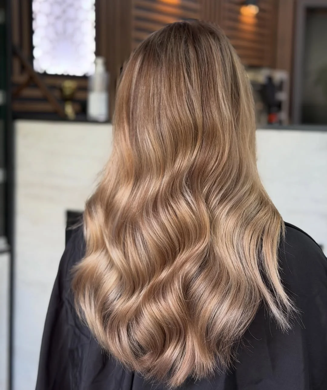 beige blond hair color Soft Beige Waves With A Seamless Luxe Finish