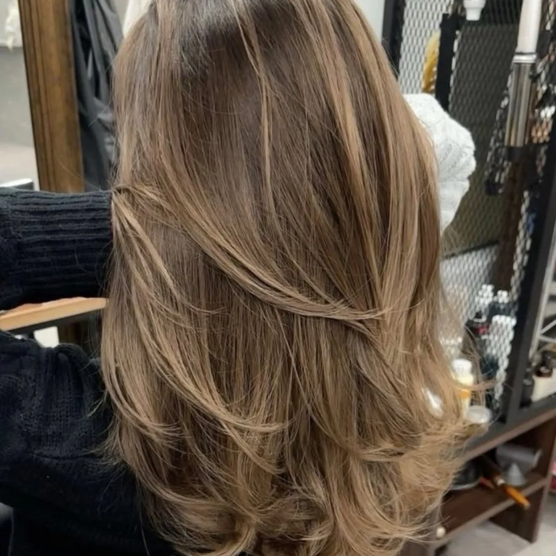 dirty blonde hair color Feathered Layers With Natural Beige Balayage