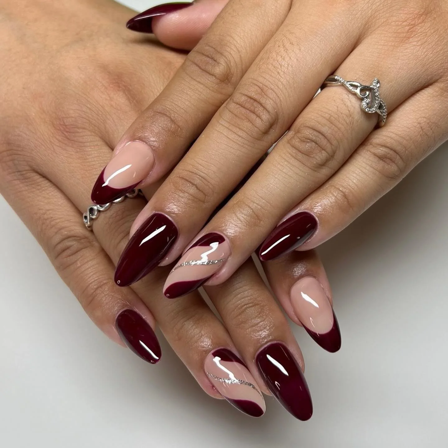 fall almond nails 2026 Elegant Burgundy Swirl Almond Manicure