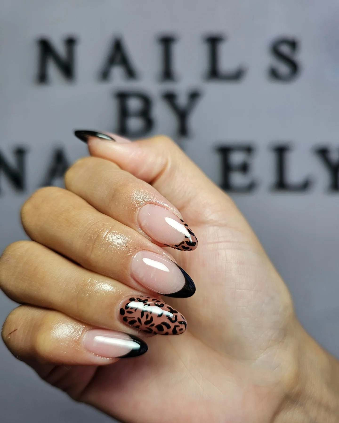 fall almond nails 2026 Black French Tips With Modern Leopard Accents