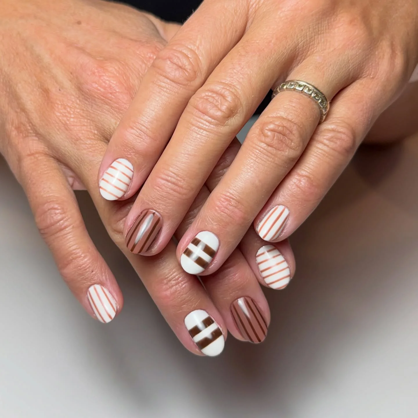 fall short nails 2026 Chocolate Stripe Short Nails With Minimalist Geometry