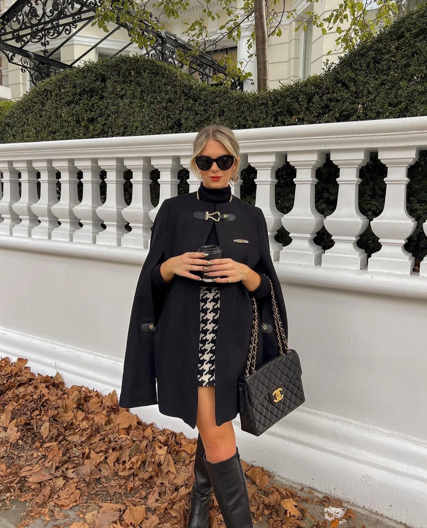 fall poncho outfits 2026 Classic Black Cape With A Chic Mini Skirt
