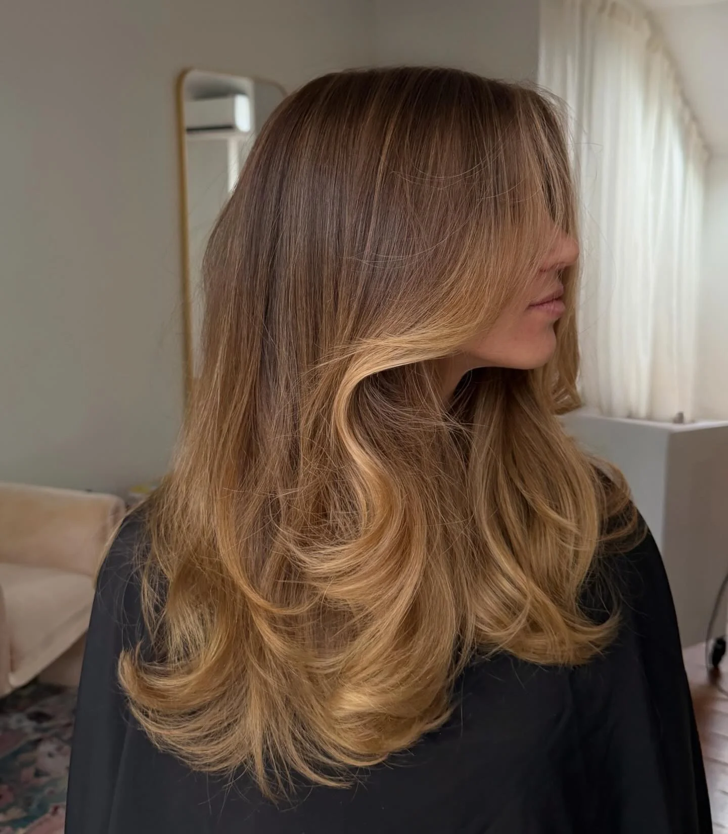 hair lowlights: color ideas and inspiration Layered Golden Blend With Feathered Volume