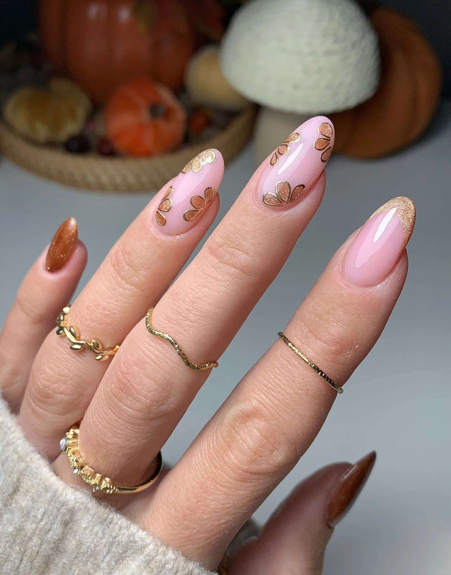 early fall nails 2026 Soft Blush Almond Nails With Golden Botanical Details