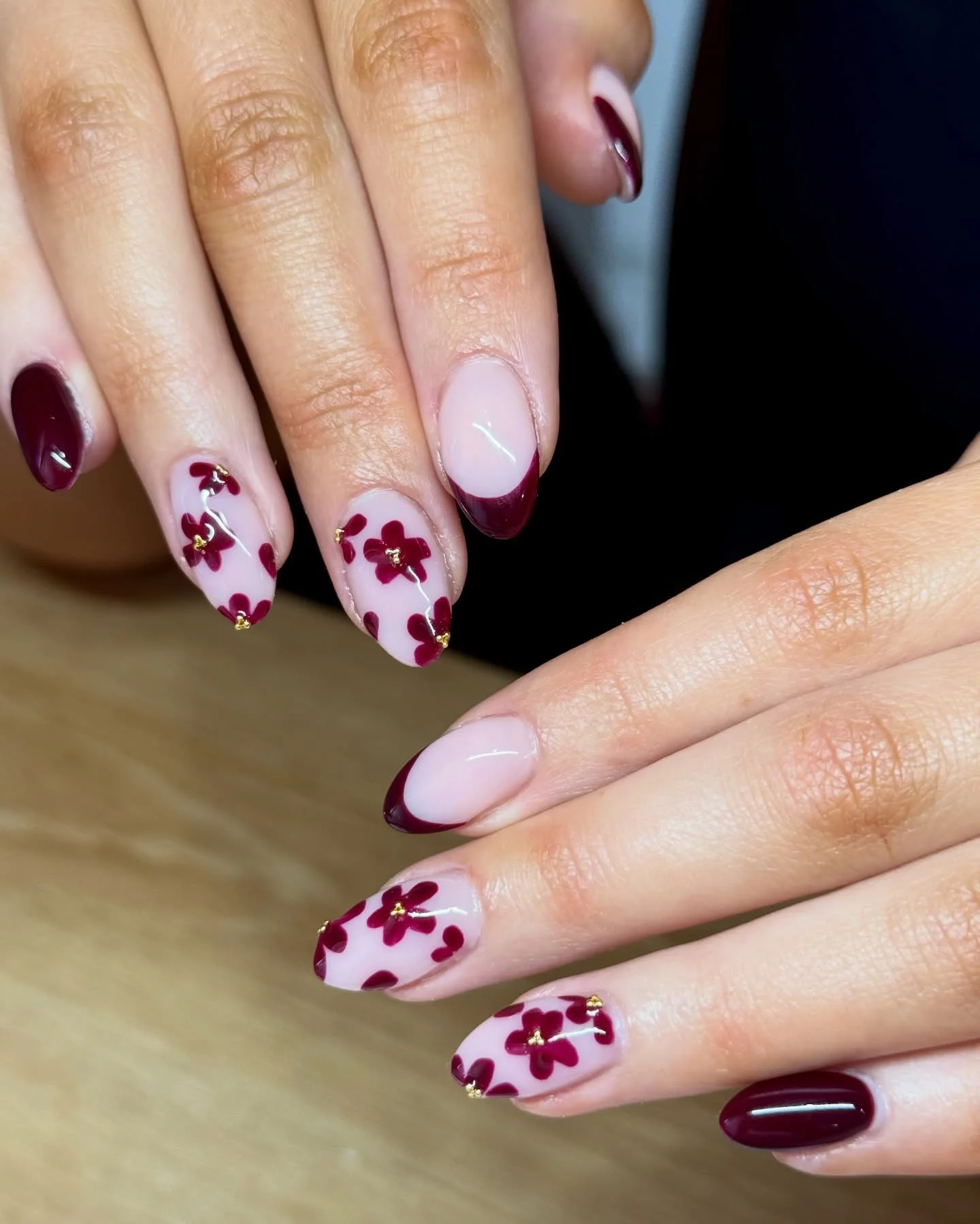 fall burgundy nails with design Burgundy Floral Nails With Delicate Gold Details
