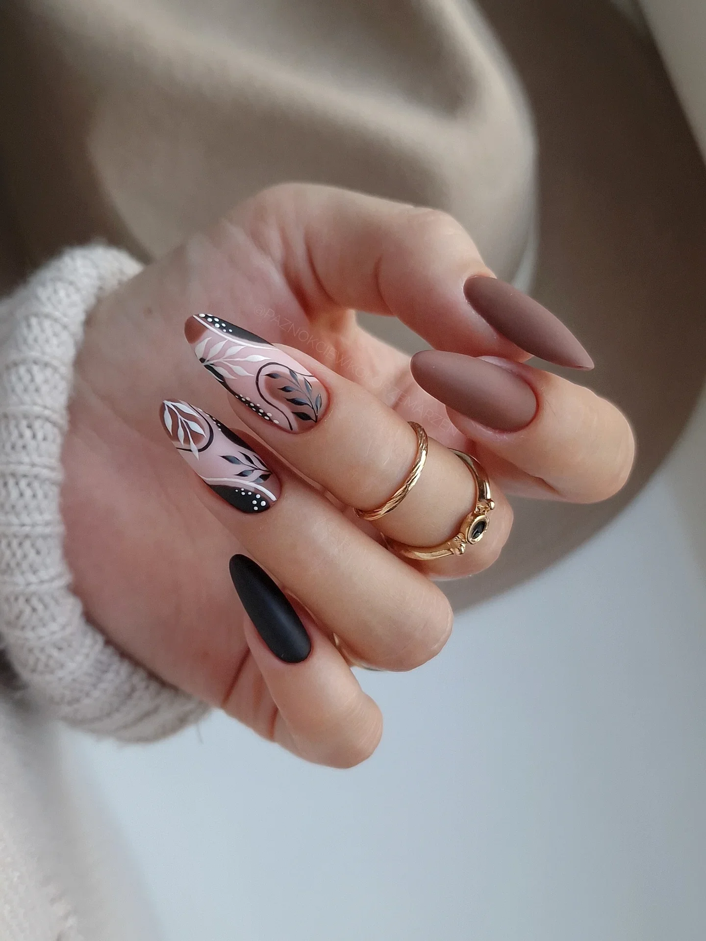 fall nails for pale skin 2026 Black Botanical Details On A Soft Nude Base