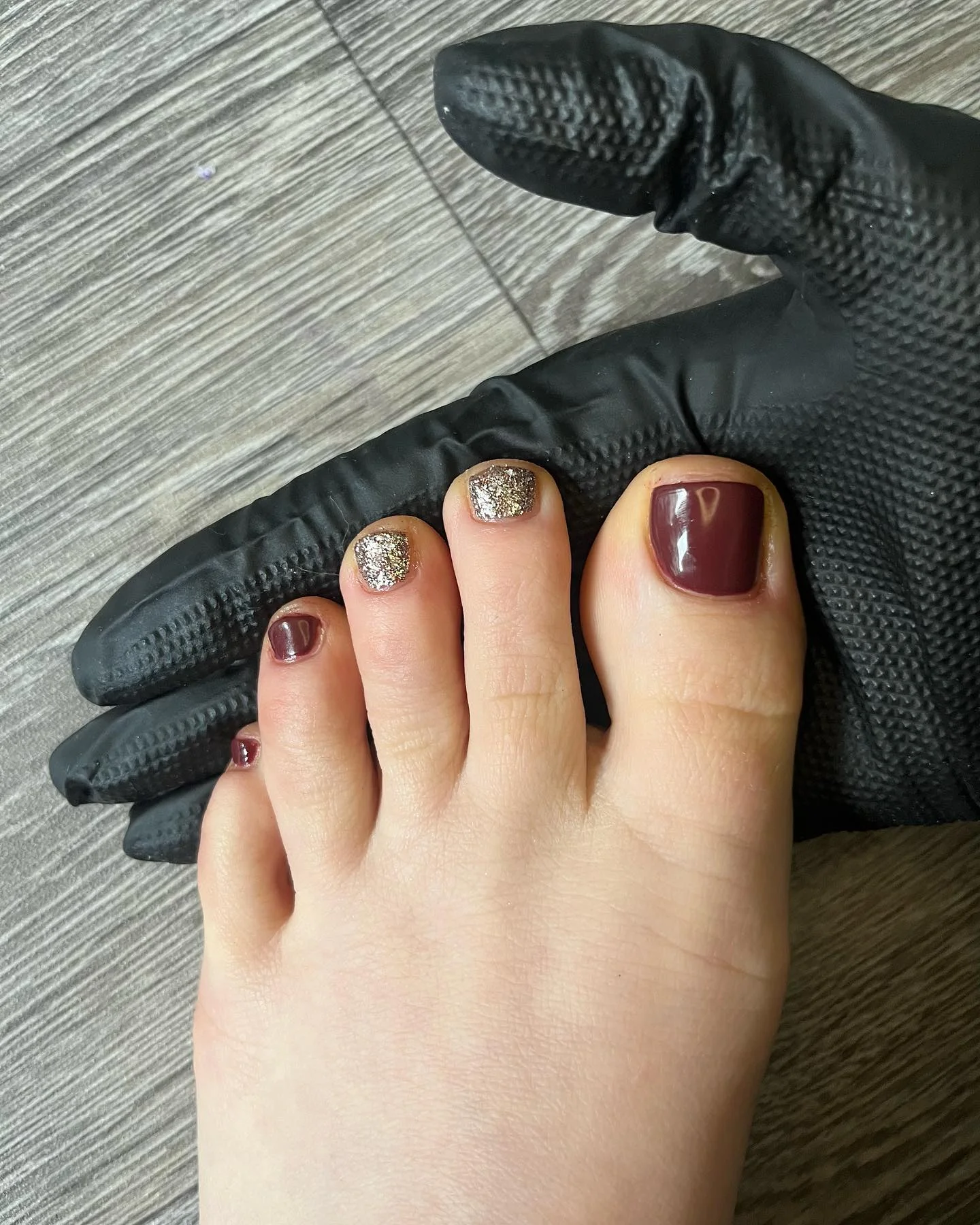 fall toe nails colors 2026 Deep Burgundy With Champagne Gold Accents
