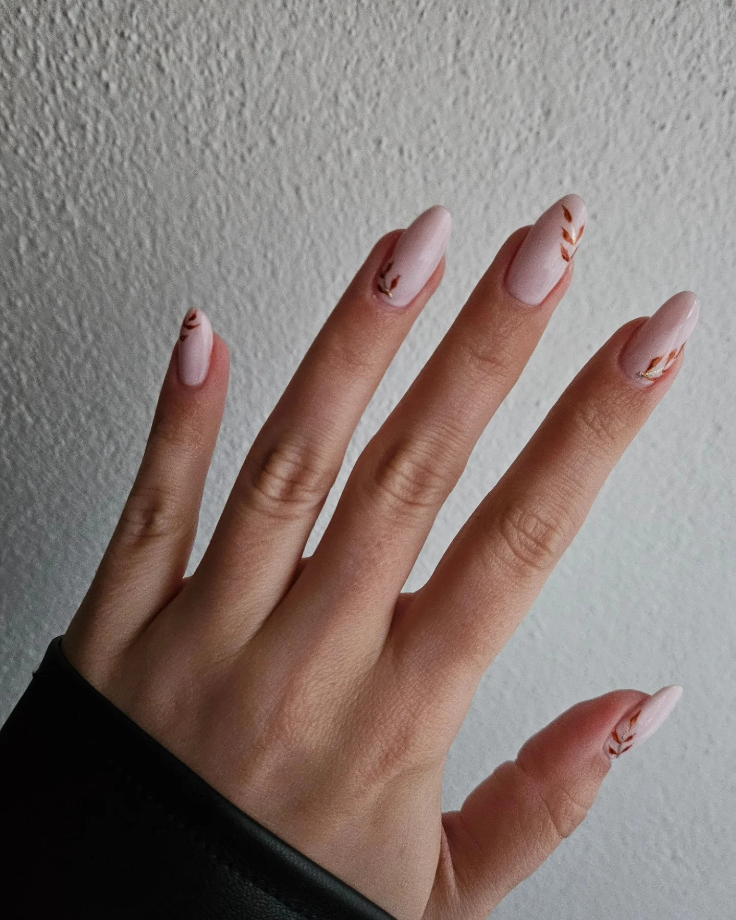 fall medium length nails 2026 Minimal Nude Nails With Tiny Autumn Leaf Details