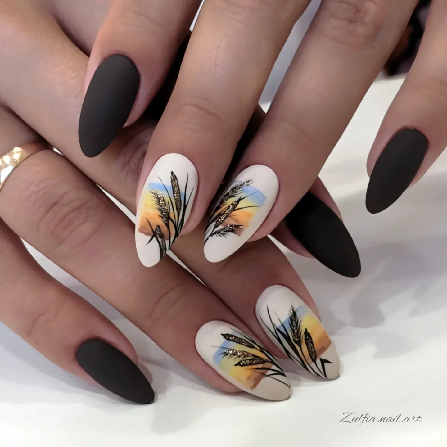 fall nails for olive skin tone 2026 Matte Black And Autumn Feather Details