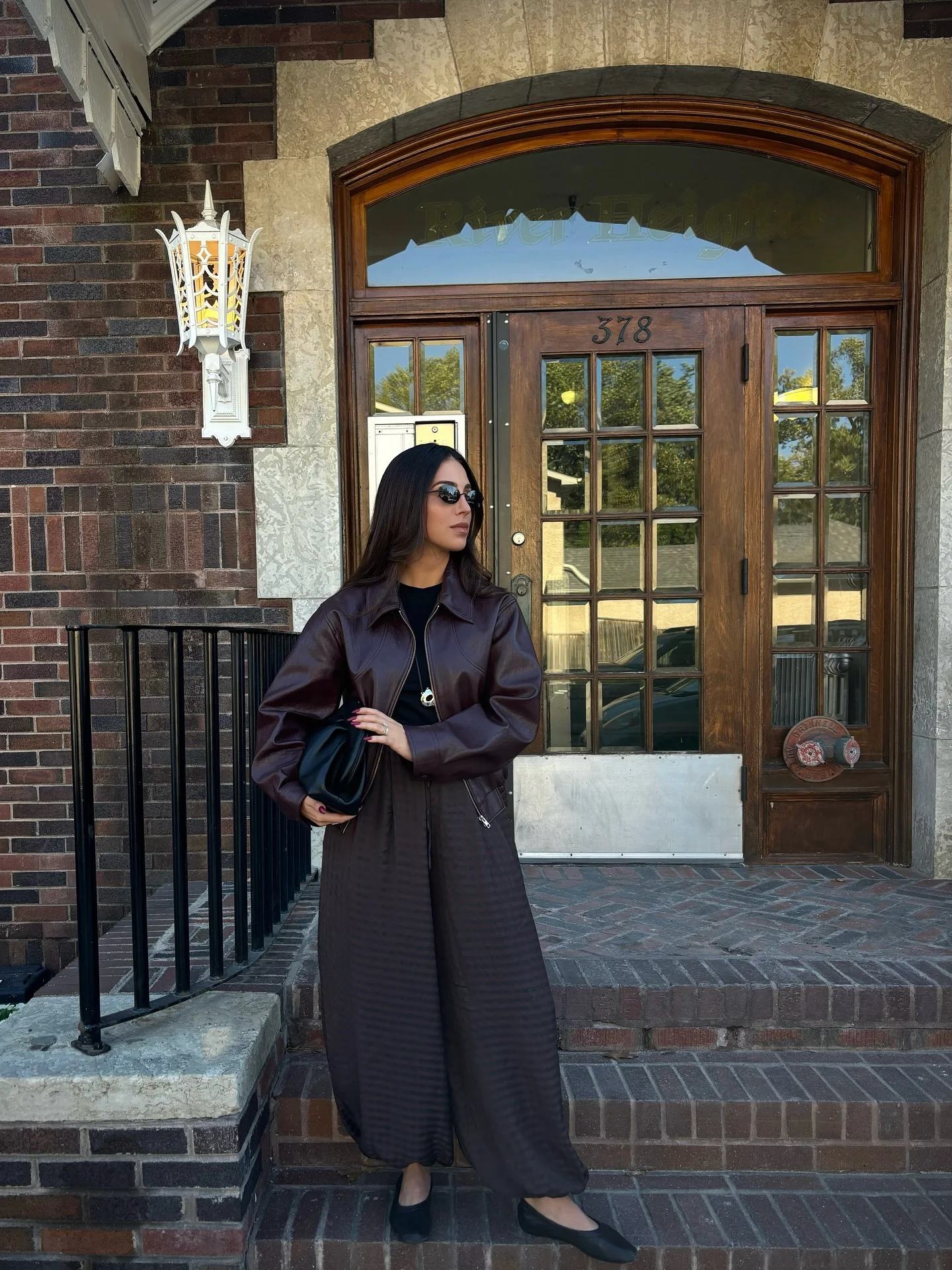 september fashion trends 2026 Dark Brown Leather Jacket With Fluid Wide-Leg Trousers