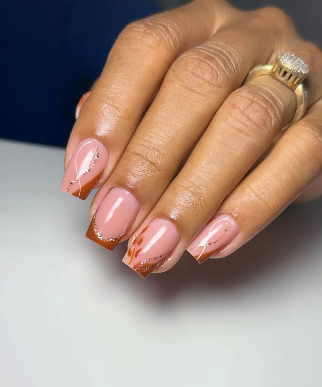 fall manicure ideas 2026 Burnt Cinnamon French Tips With Delicate Glitter Waves