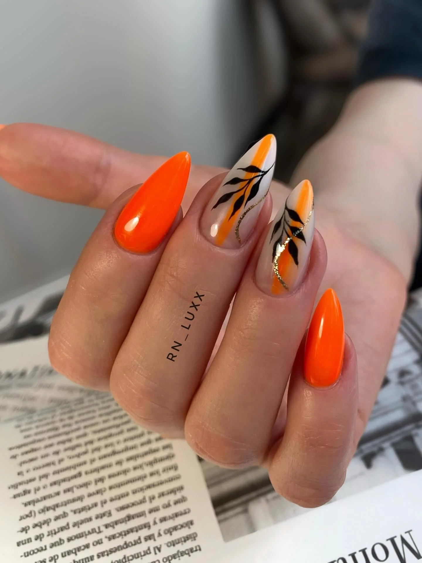 fall nails with autumn designs Vibrant Orange Almond Nails With Botanical Black Details