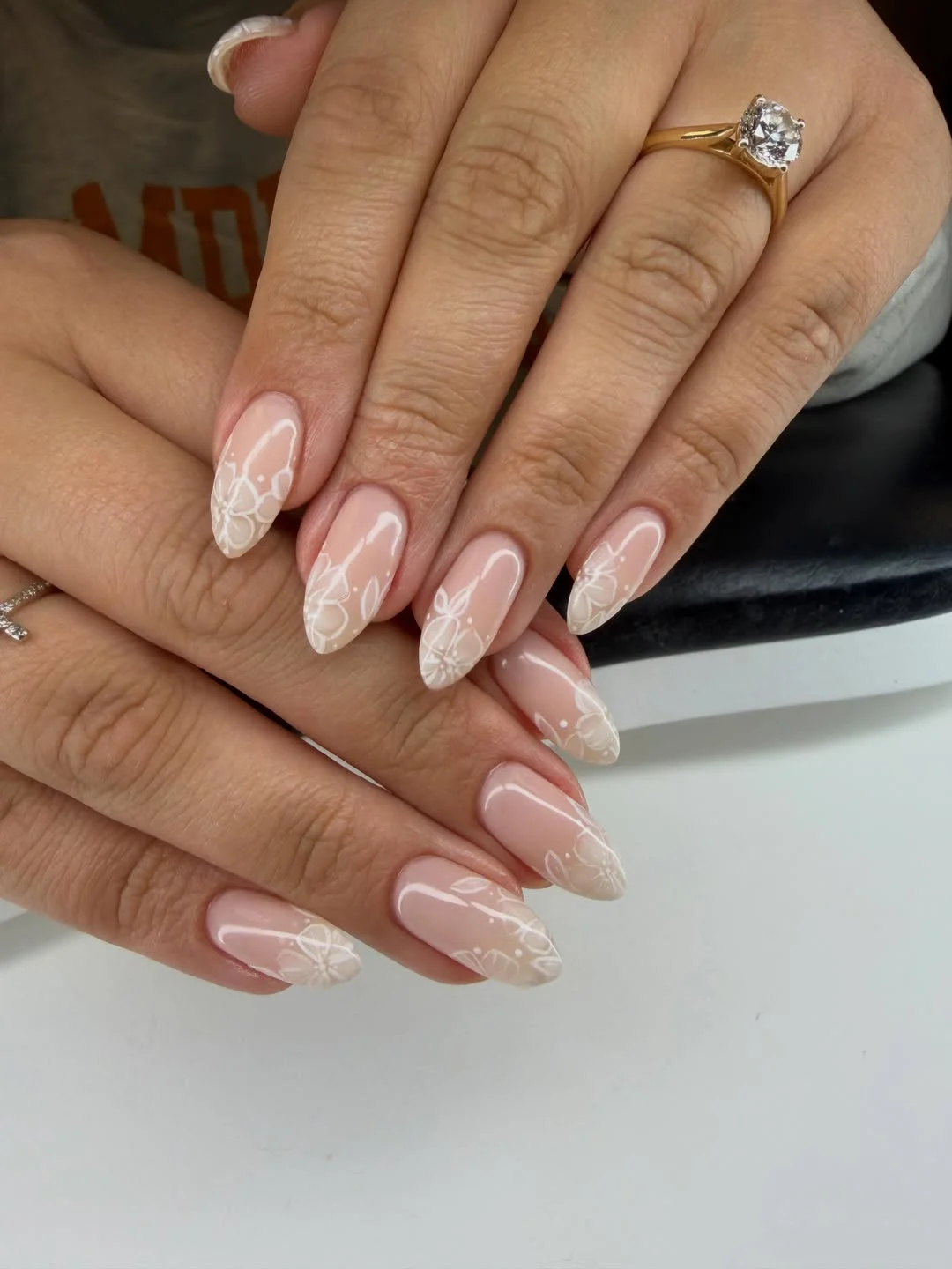 fall wedding nails 2026 Minimal Floral Almond Nails With Airy White Outlines