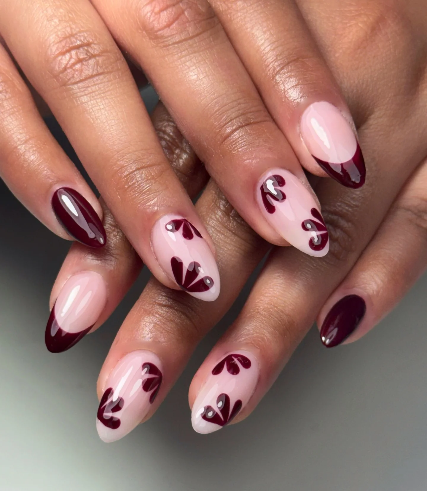 fall burgundy nails with design Burgundy French Tips With Playful Floral Details