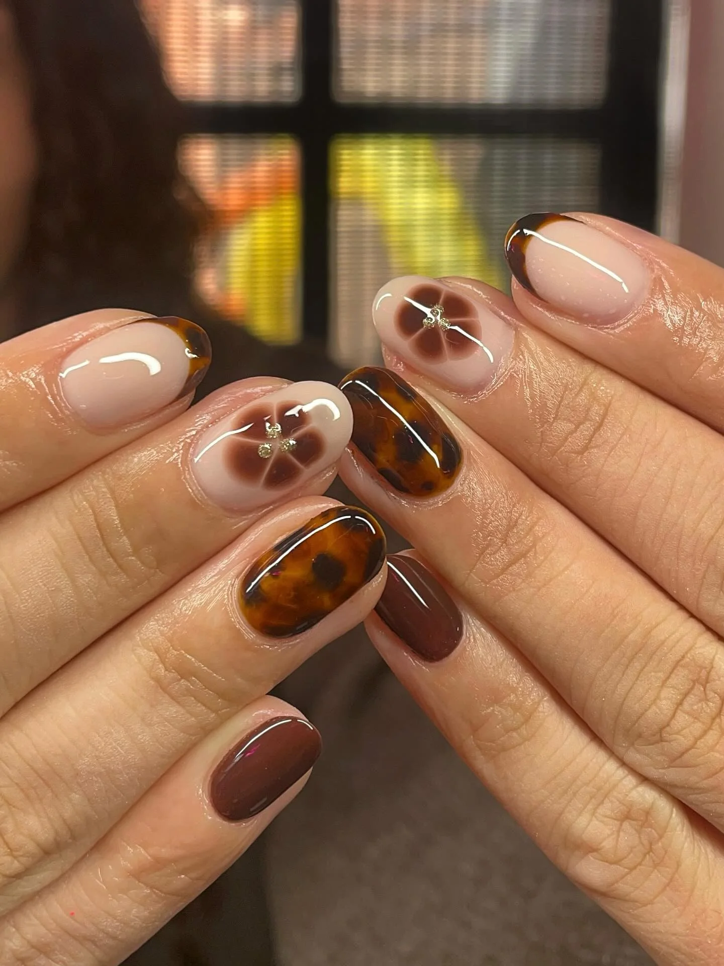 fall gel nails ideas 2026 Tortoiseshell French Tips With Cocoa Floral Details
