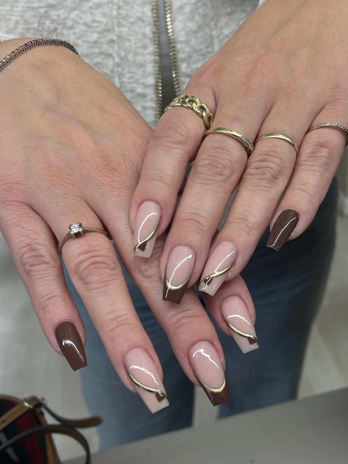 fall nail inspiration 2026 Chocolate French Tips With Flowing Gold Lines
