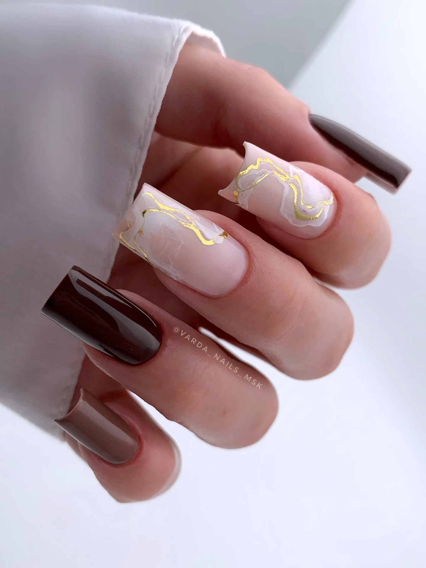 fall nails for olive skin tone 2026 Milky Marble With Gold And Deep Espresso