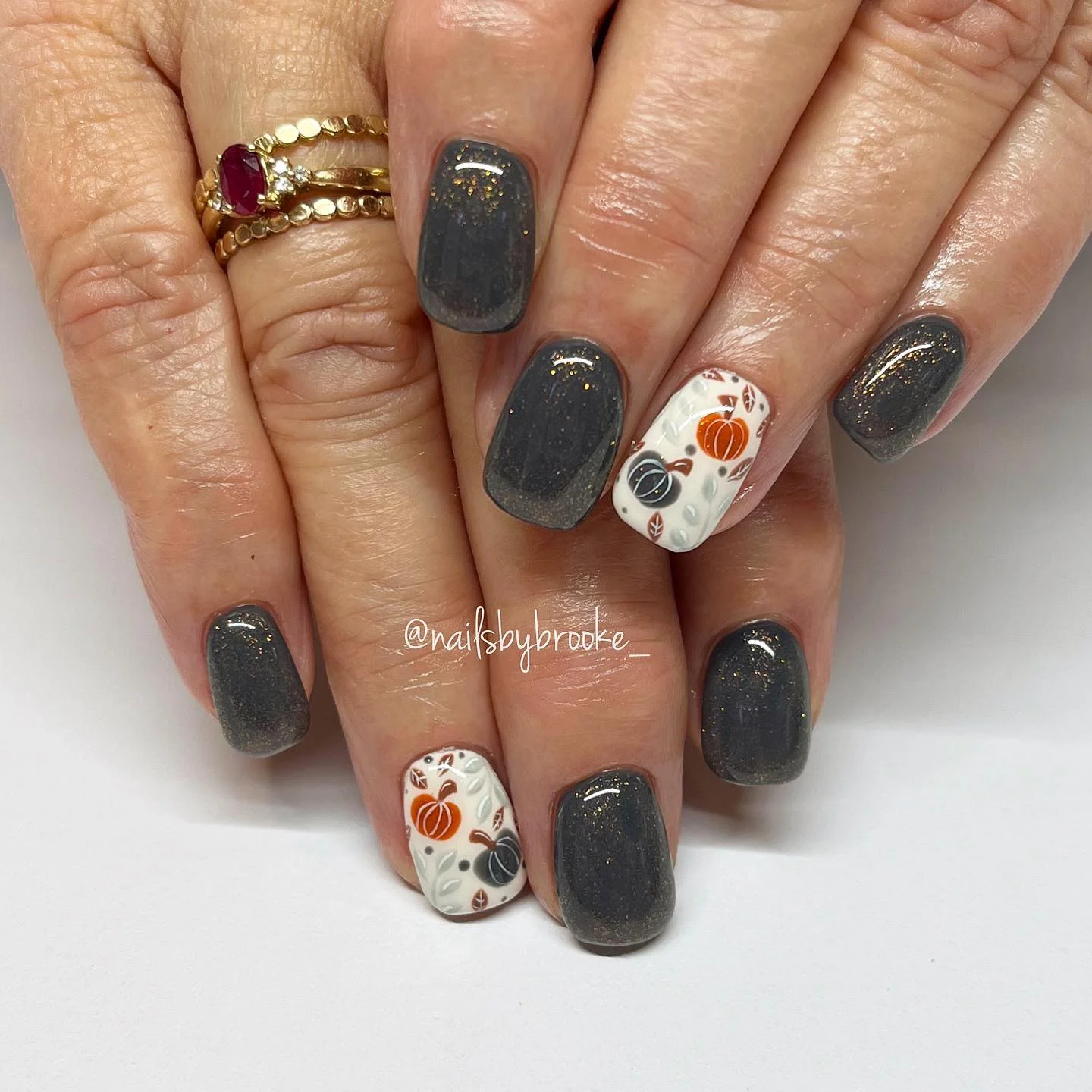 fall nails with accent nail Charcoal Glitter With Tiny Autumn Pumpkin Accents