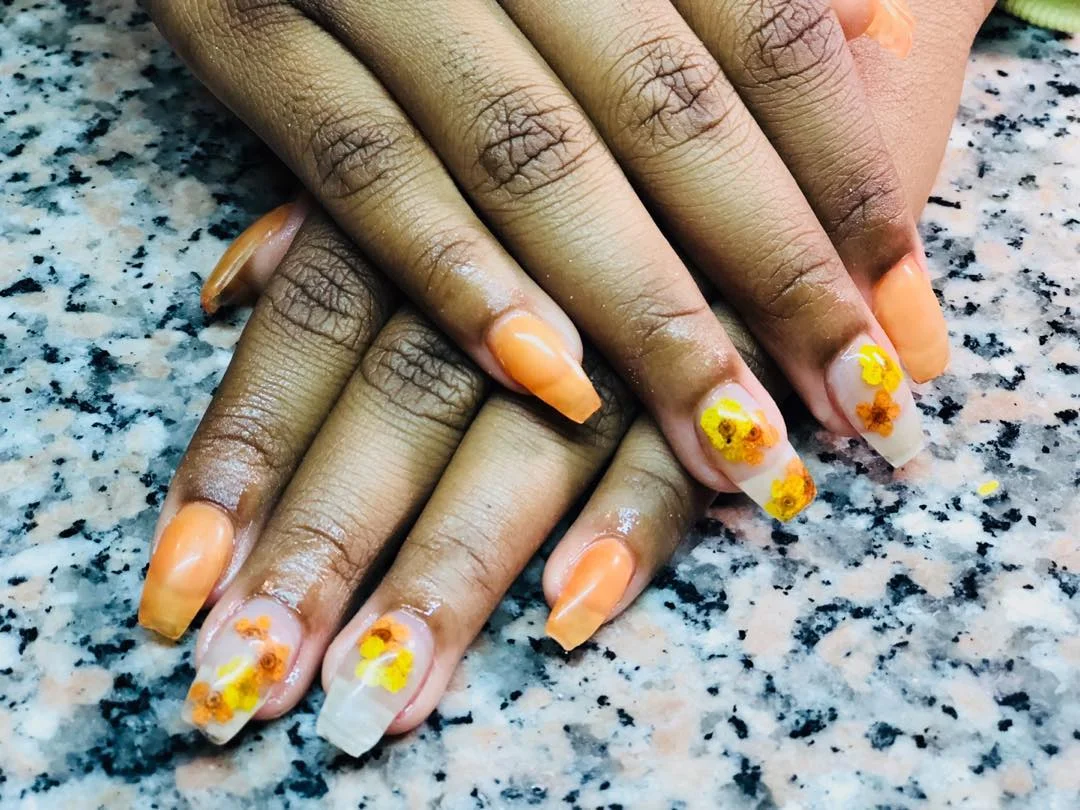 fall short coffin nails designs 2026 Bright Orange Coffin Nails With Cheerful Autumn Flowers