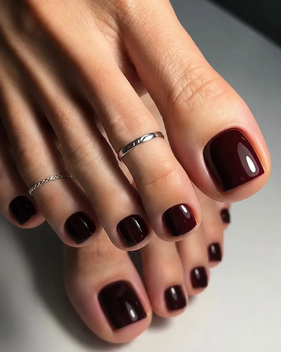 fall toe nails colors 2026 Blackened Burgundy With A High-Gloss Finish