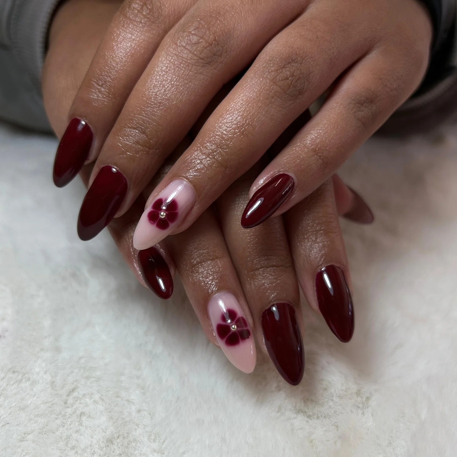 fall burgundy nails with design Dark Burgundy Almond Nails With Minimal Flower Accents