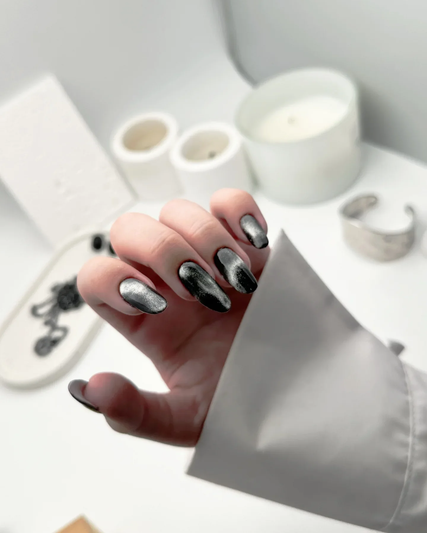 fall dark nail shadow ideas 2026 Smoky Black And Silver Metallic Almond Nails