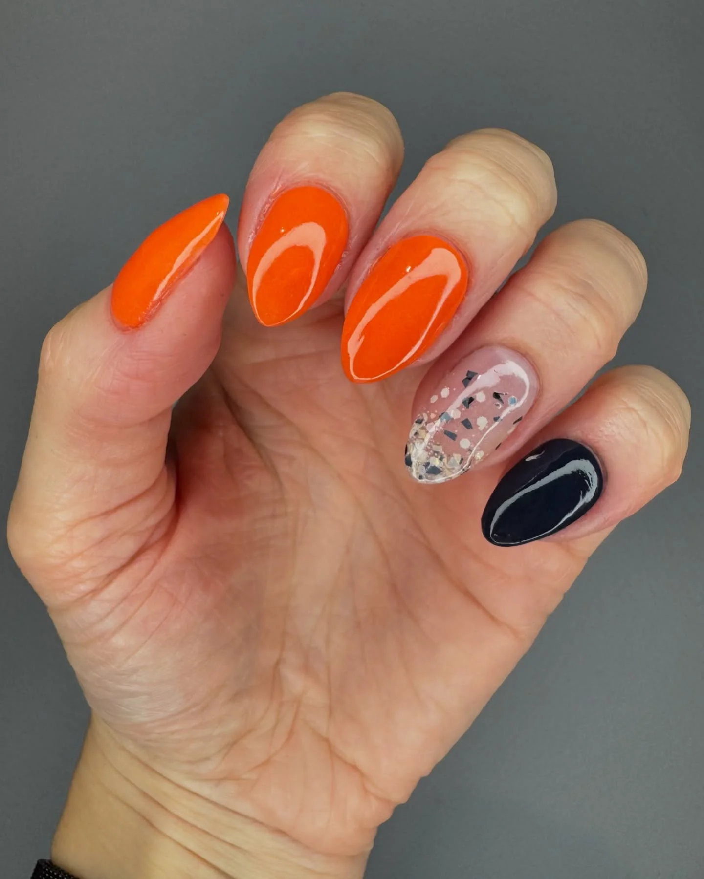 fall dip nails 2026 Bright Orange Graphic Almond Nails