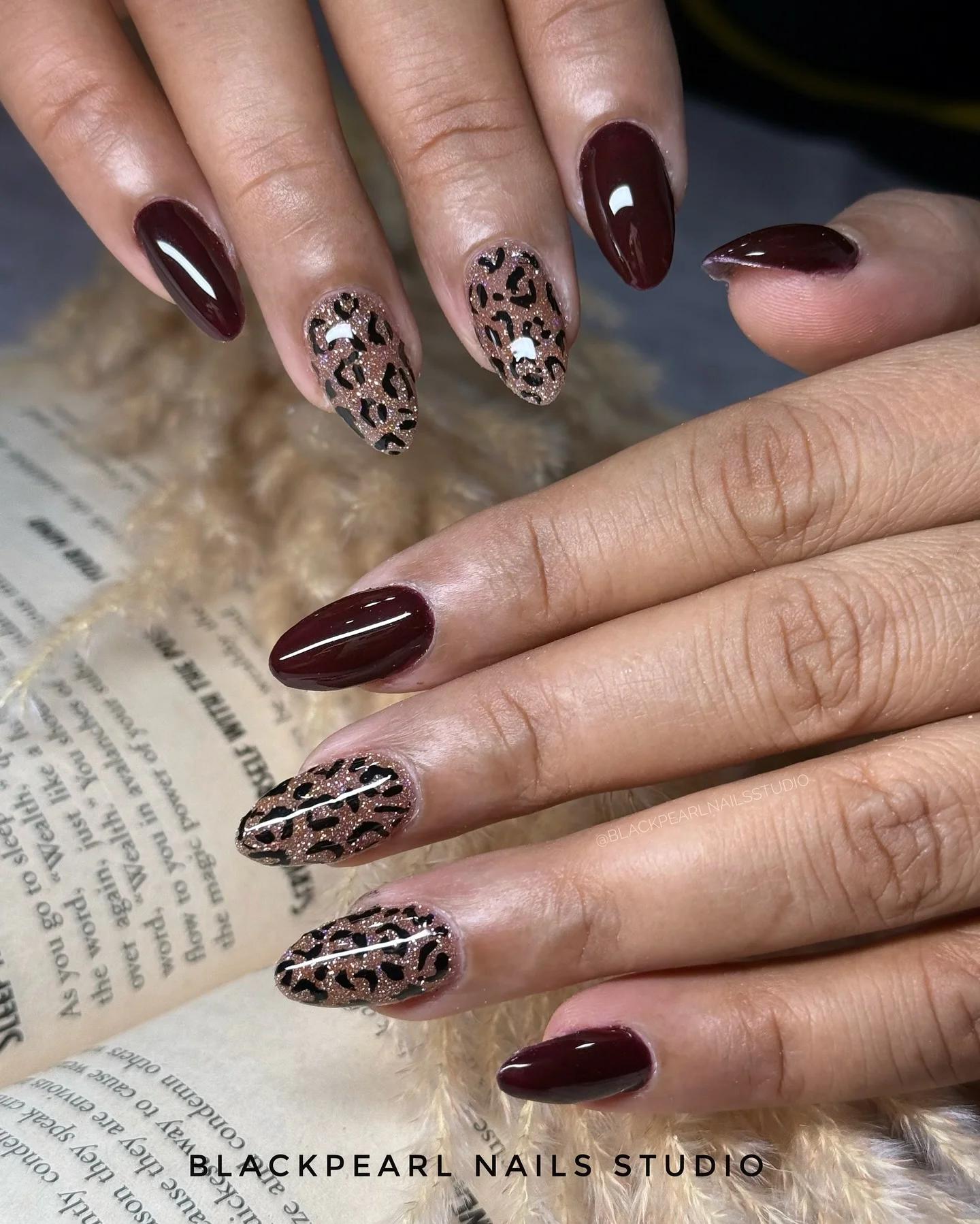fall gel nails ideas 2026 Deep Wine Nails With Glitter Leopard Accents